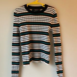 Long sleeve striped crop top.